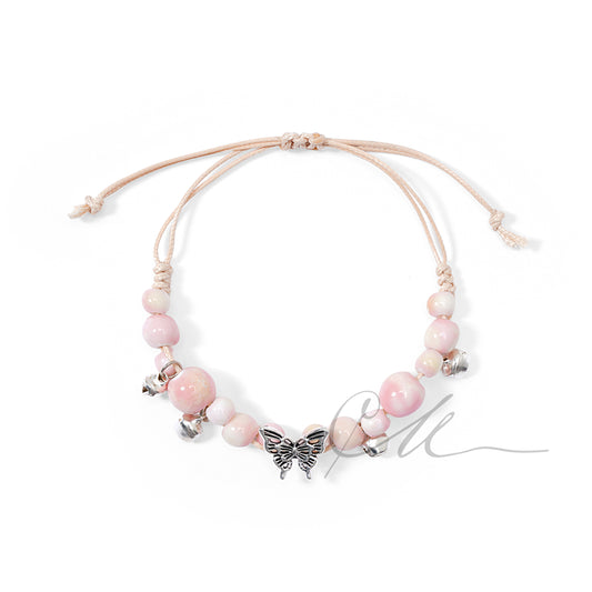Serica | Handmade Pink Ceramic Butterfly Charm Bracelet – Soft Cotton Cord